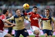 NOTTINGHAM, ENGLAND - DECEMBER 29:  Gonzalo Jara of Nottingham Forest challenges Ross McCormack of Leeds United during the Sky Bet Championship match between Nottingham Forest and Leeds United at City Ground on December 29, 2013 in Nottingham, England, (Photo by Tony Marshall/Getty Images)